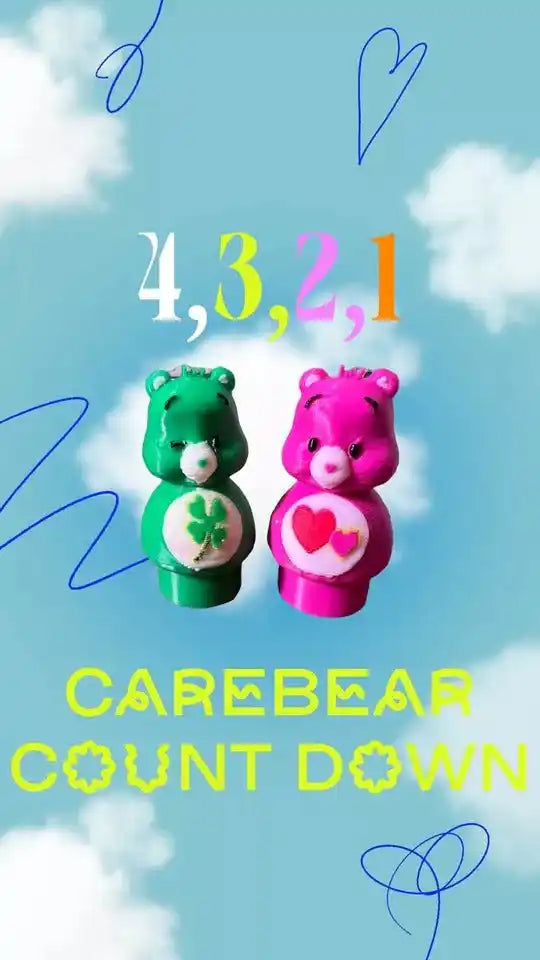 Two custom "Little People" style Care Bear figures, Funshine Bear (green with clover) and Love-a-Lot Bear (pink with hearts)