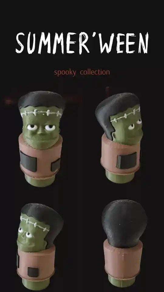 A custom, green Frankenstein Little People figure with black hair and stitches