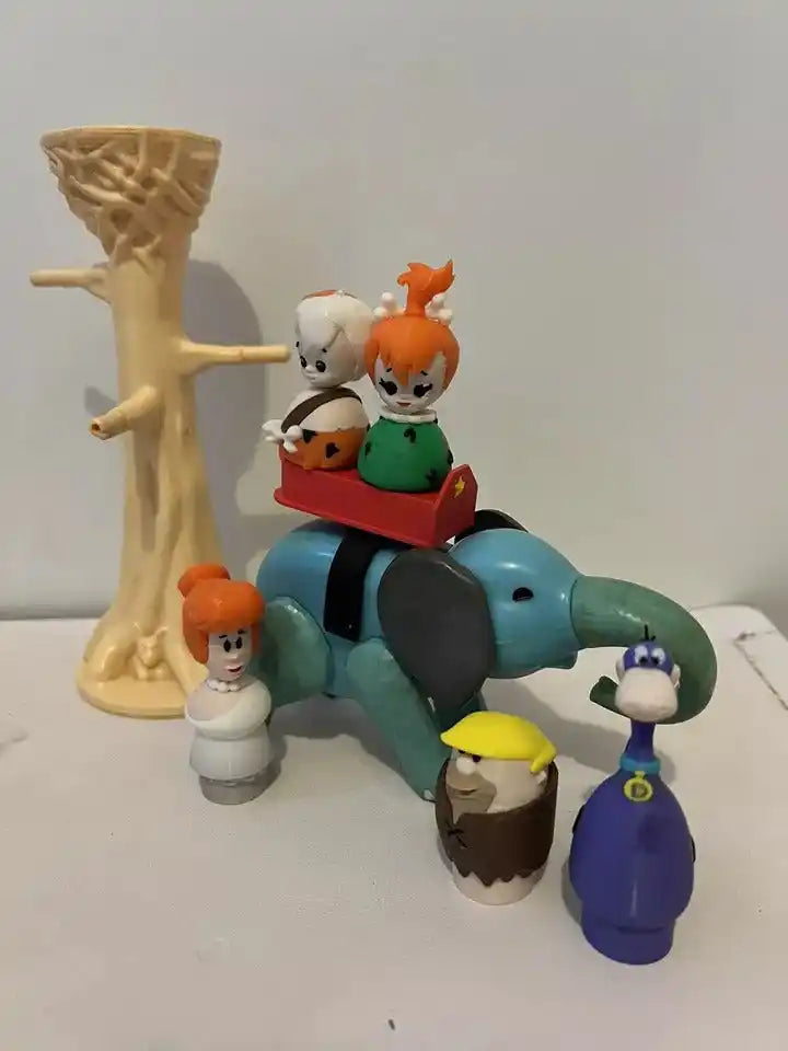 Custom Fisher-Price Little People figures of Pebbles Flintstone, Dino, and other characters, with a tree and elephant.