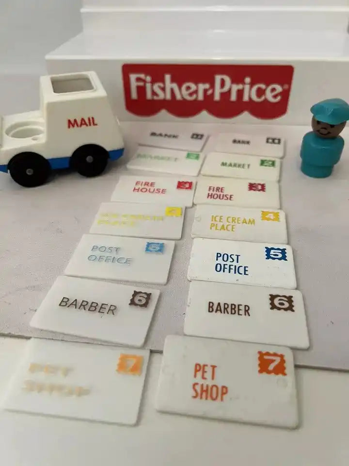 Seven custom 3D printed Fisher-Price Little People Main Street replacement mail pieces, with a toy mail truck and figure.
