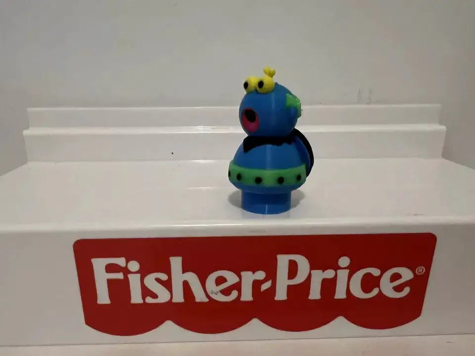 Blue and green bug-style figure from side with yellow antennae and open red mouth