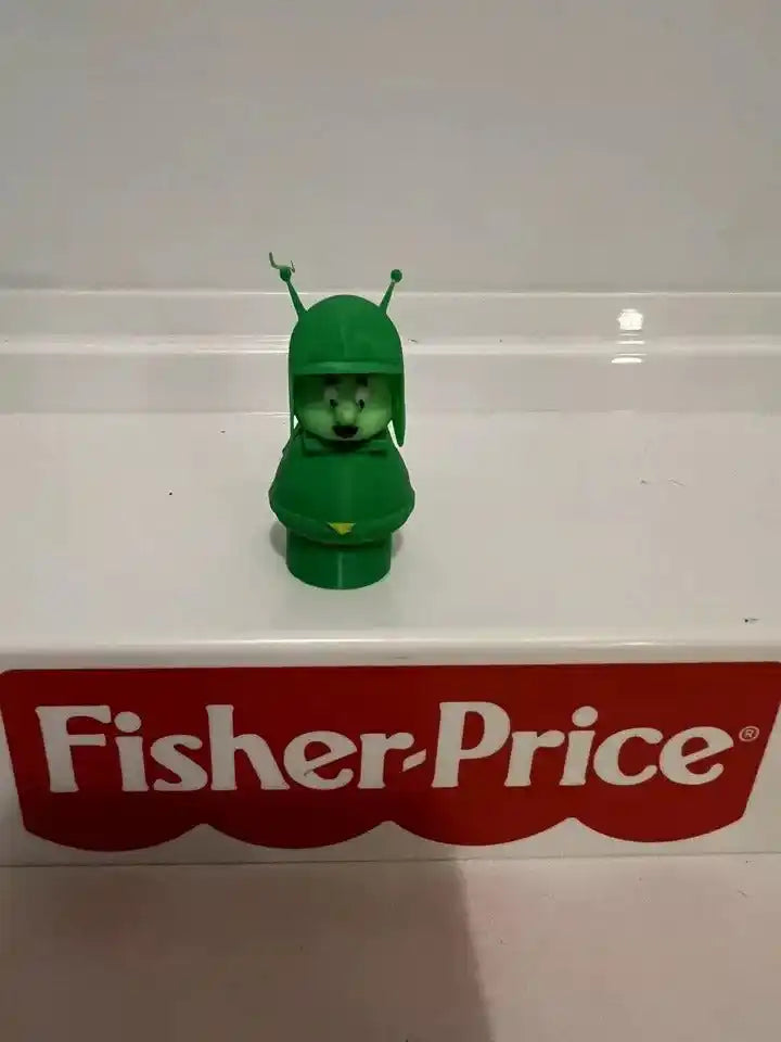 A 3D-printed custom "Flintstones - The Great Gazoo" Little People figure in green on a white surface with a red Fisher-Price logo.