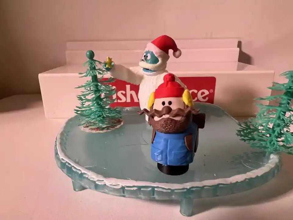 Christmas holiday figurine set with Santa-like figure and nutcracker-style character on icy base
