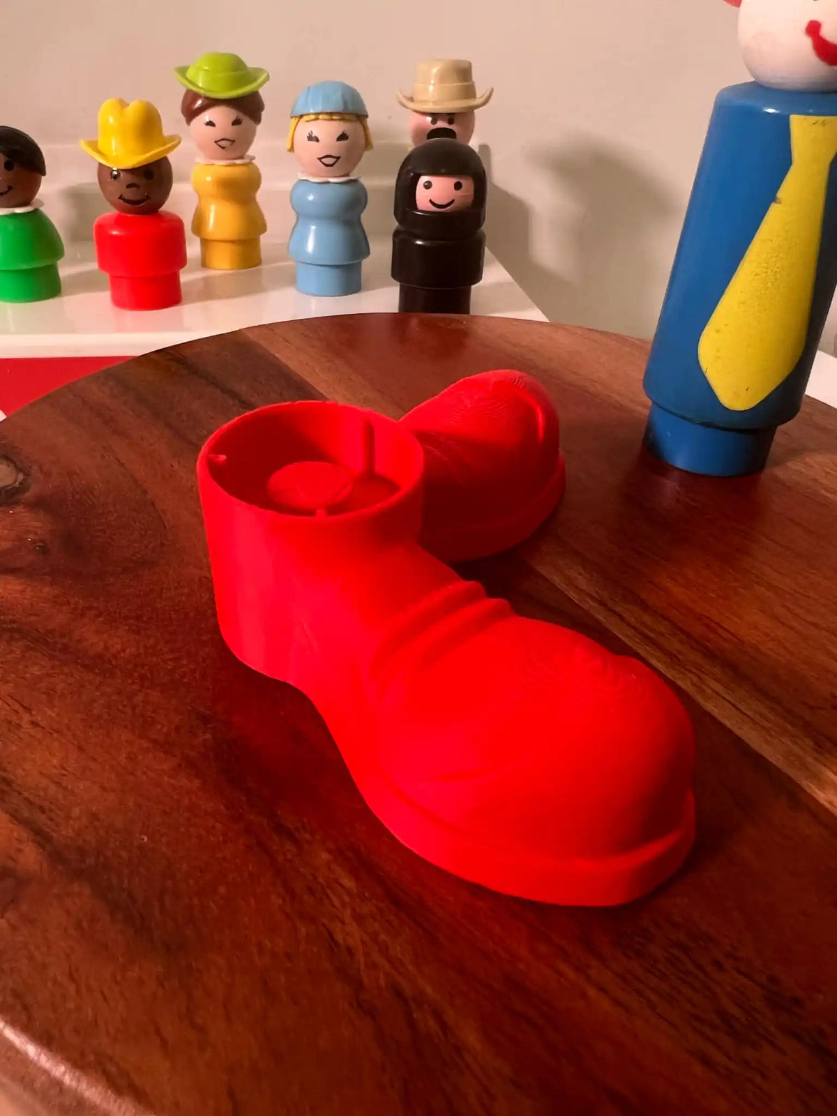 Fisher Price oversized red clown shoes, angled side view