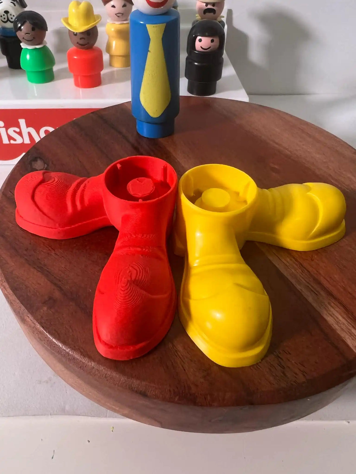 Fisher Price replacement clown shoes in red and yellow, angled together