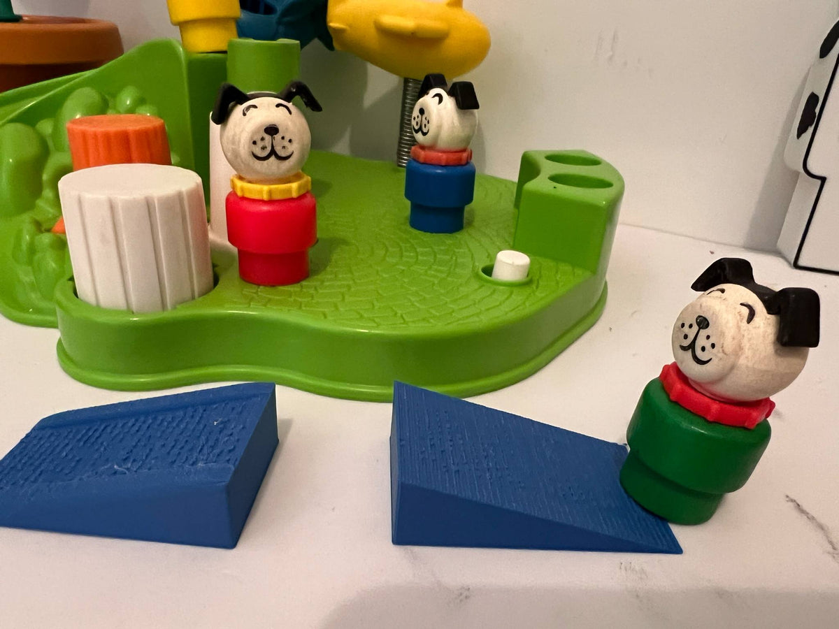 Green play tray with multiple dog-shaped toy figures and blue blocks