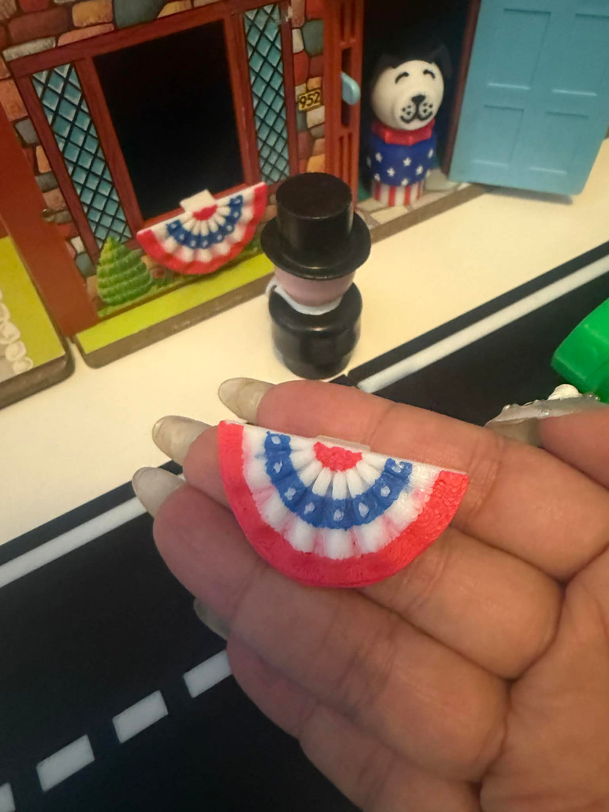 Small red white blue bunting flag ornament with semicircle scalloped trim