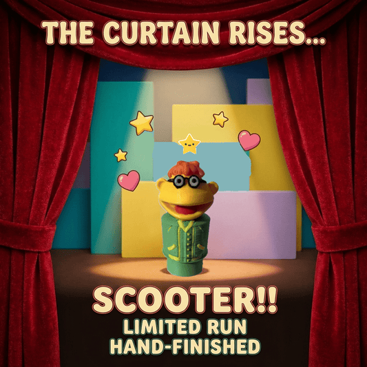 Custom muppet figure on stage with red curtains, orange hair, black goggles, green jacket