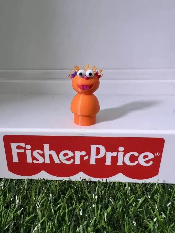 Orange two-part cartoon figure with spiky hair and big eyes, front view