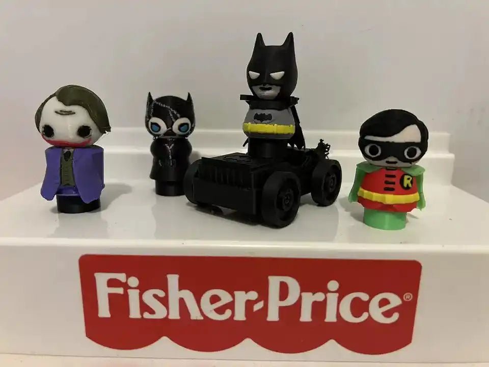 Black cat character figurine with blue eyes and pointed ears, standing next to other figures