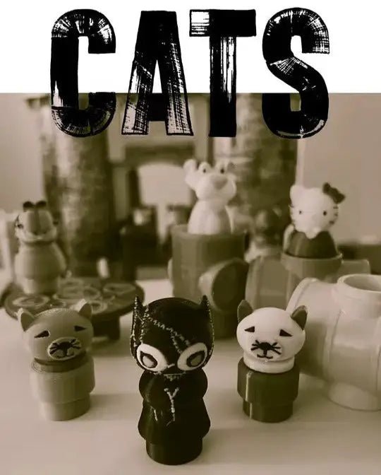 Black cat character figurines with blue eyes, pointed ears, standing pose on base