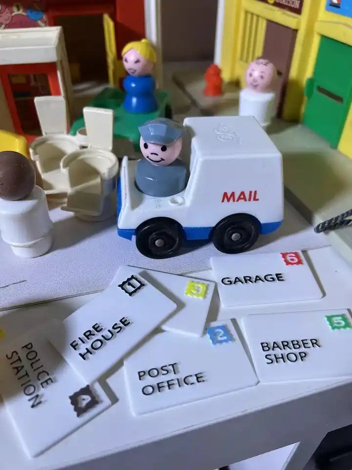 A custom Fisher-Price Little People mail truck with a mailman figure delivers replacement mail pieces