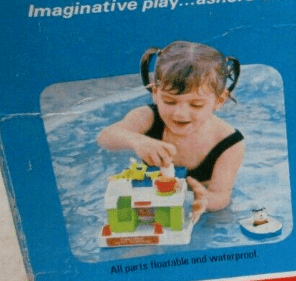 Toddler playing with houseboat toy accessories on a blue inflatable pool