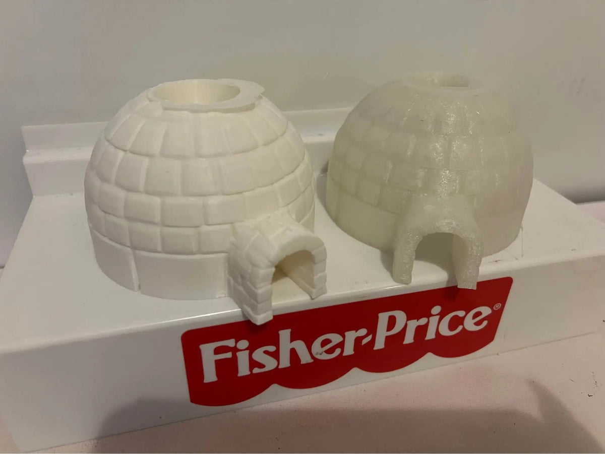 Snow white and translucent igloo-shaped holiday toys with arched doorways, side view