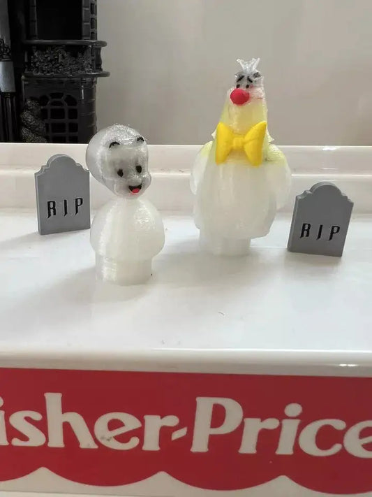 A custom Casper the friendly ghost Little People figure, next to a matching clown ghost, with two RIP tombstones.