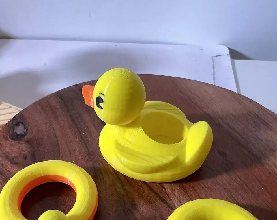 Yellow duck floatie with orange beak, large inner ring, and molded texture