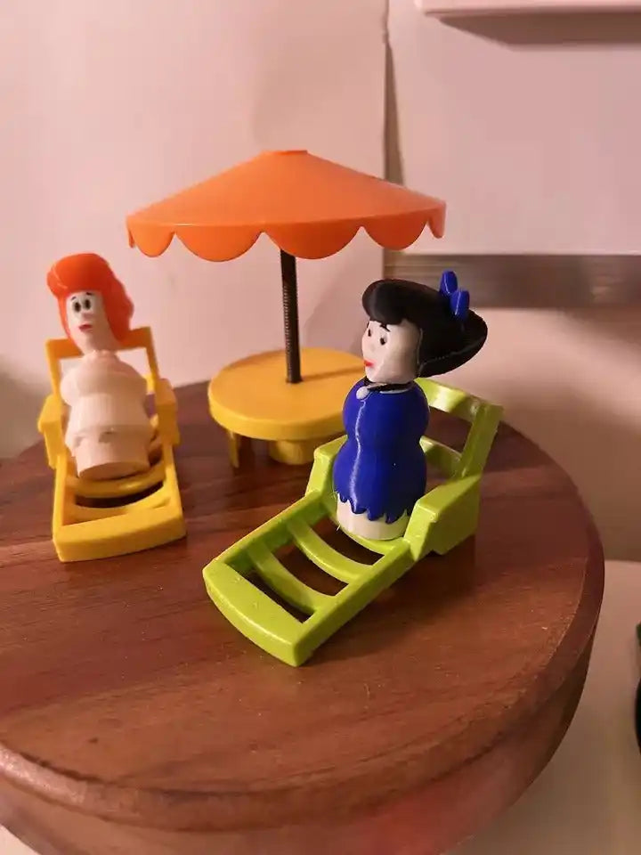Flintstones Betty figurine, blue dress, black hair, on umbrella swing set