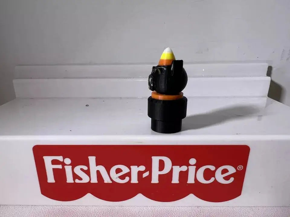 A 3D-printed custom Halloween Spooky Little People figure, Joanna Parker-inspired, wearing a candy corn hat