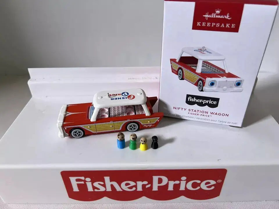 Red, yellow, and white station wagon ornament with four small passenger figures