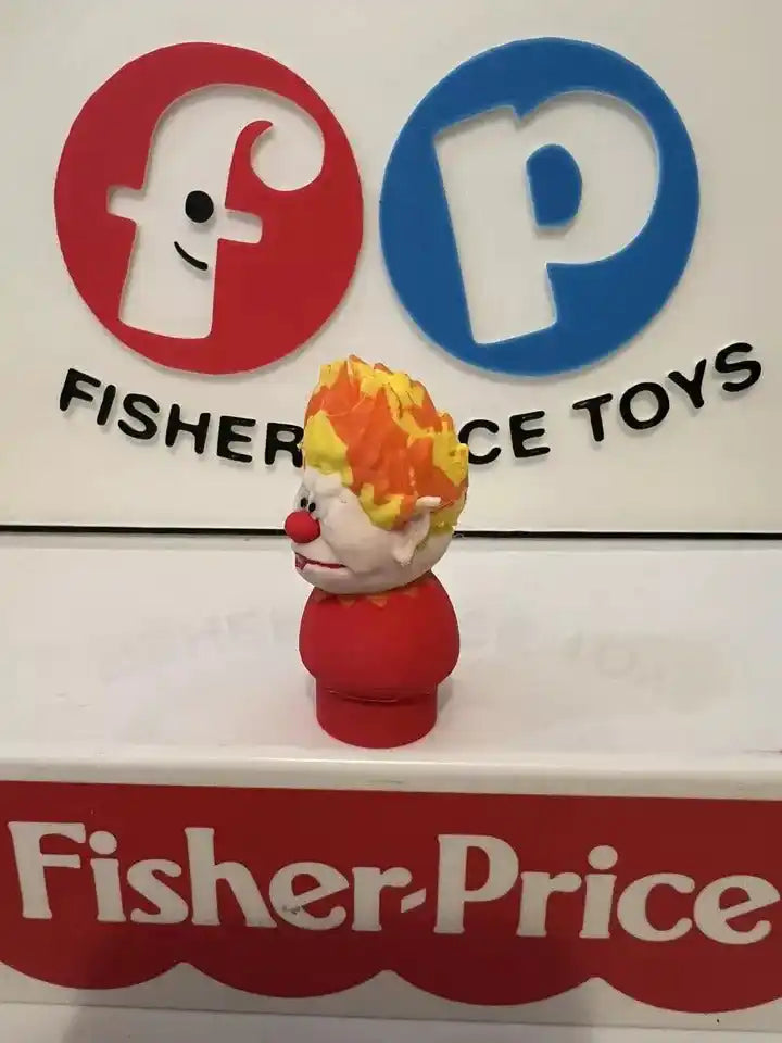 Front view red and white holiday Heat Miser figure with orange flame hat
