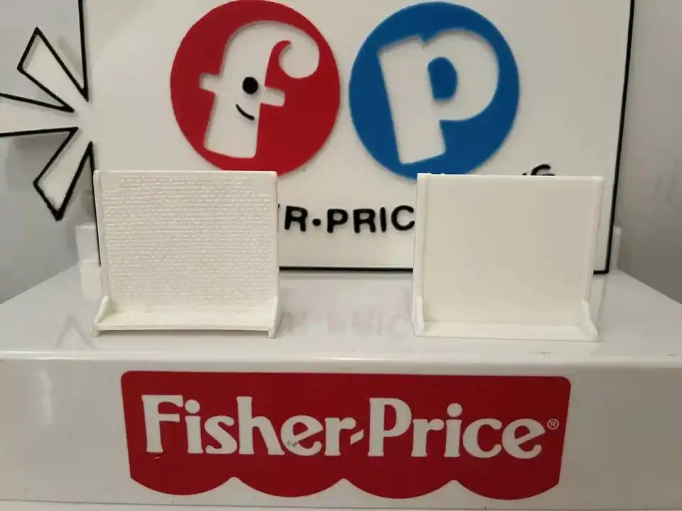 A custom 3D printed privacy screen for a Fisher-Price #931 Hospital playset stands next to a plain screen.