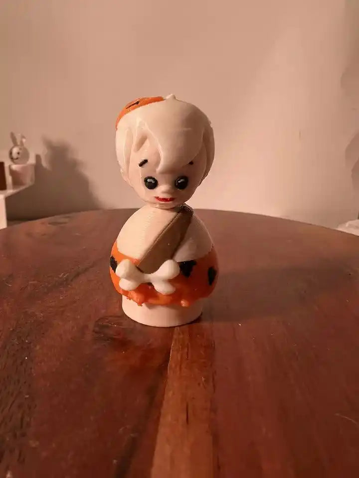 A custom 3D printed Flintstones Bam Bam Little People vintage-style figure with white hair and an orange club.