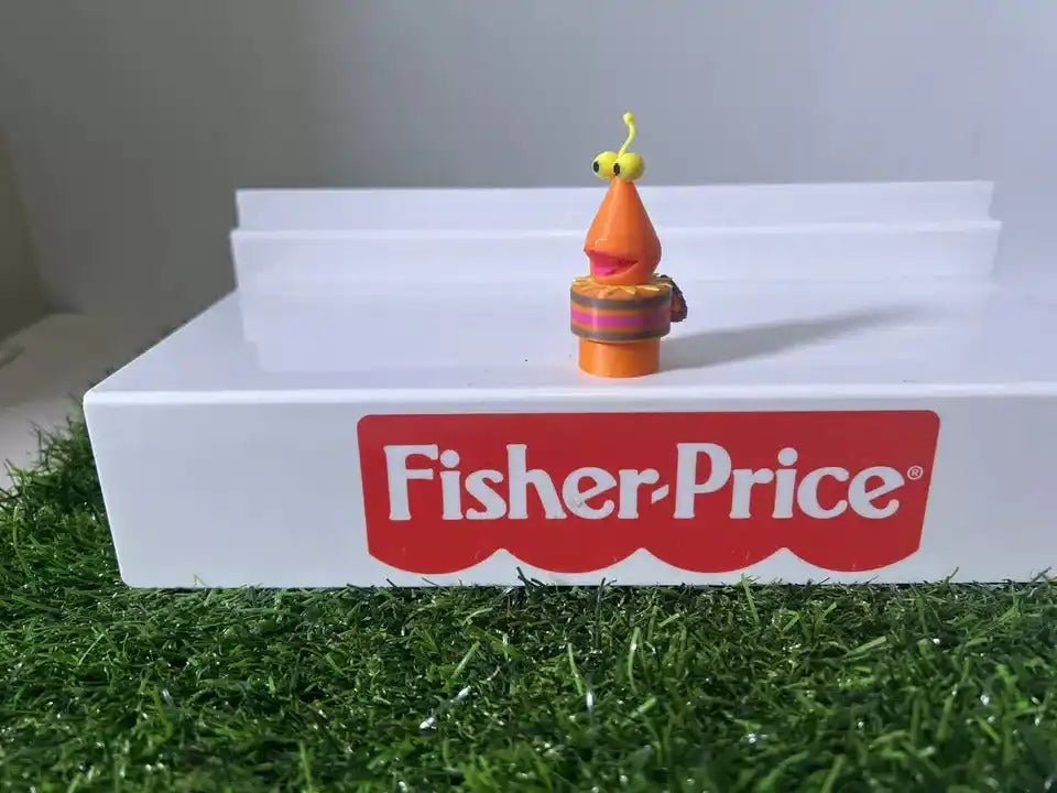Fisher-Price bug-themed toy figure on white step with red Fisher-Price logo