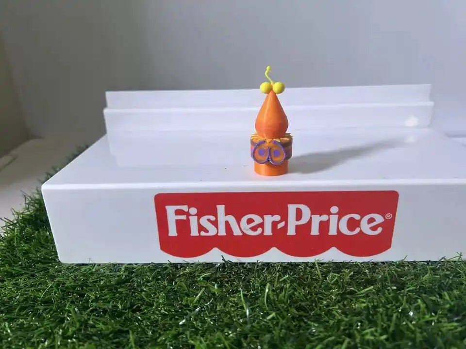 Small orange bug toy with antennae on white step, Fisher-Price logo in red panel