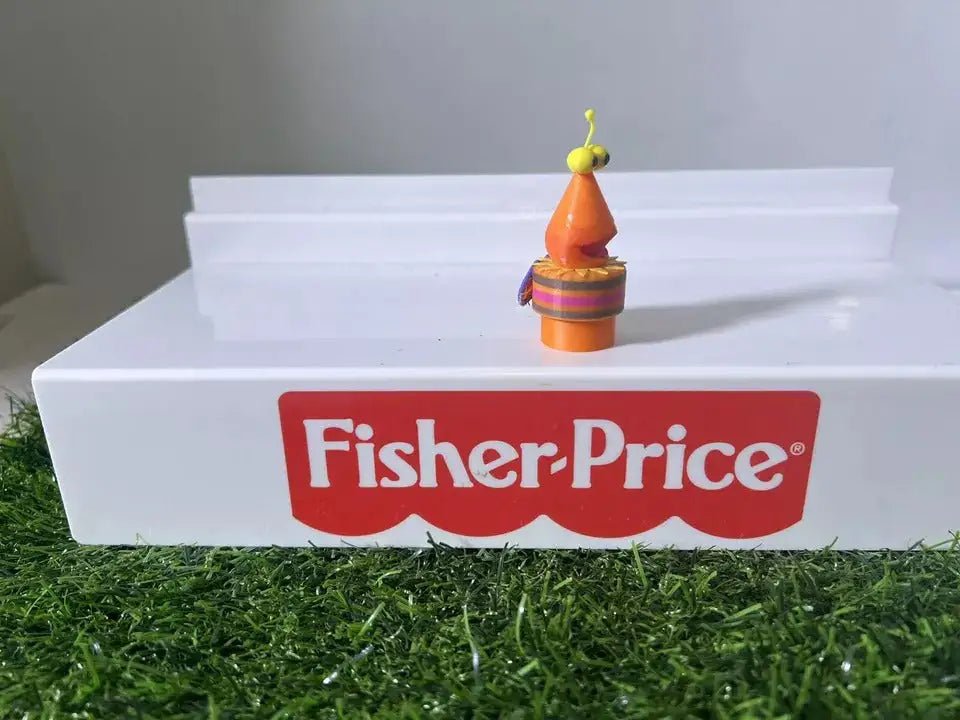 Fisher-Price bug toy figure standing on white steps, red Fisher-Price logo visible