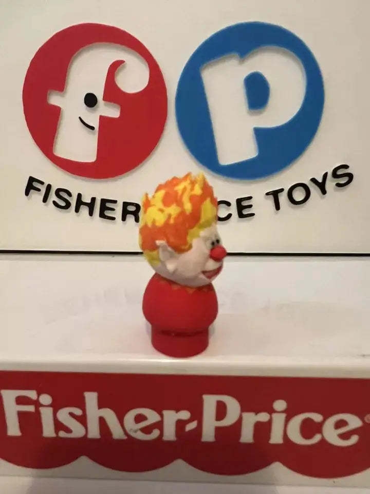 Side view red and white holiday Heat Miser figure with orange flame hat