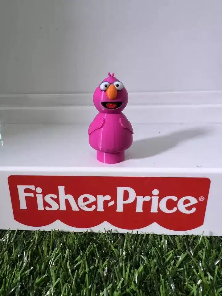 Pink bird-like fan art figure standing upright, molded details and smiling face