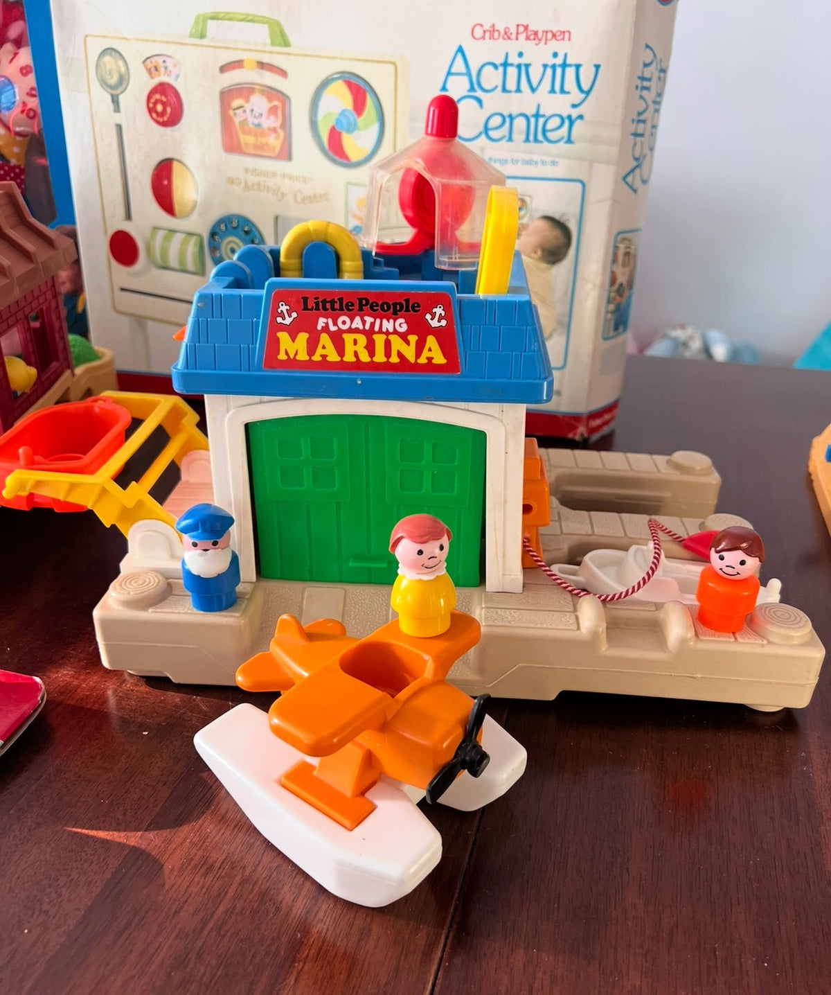 Fisher Price Floating Marina playset with green dock building, boats, and figures