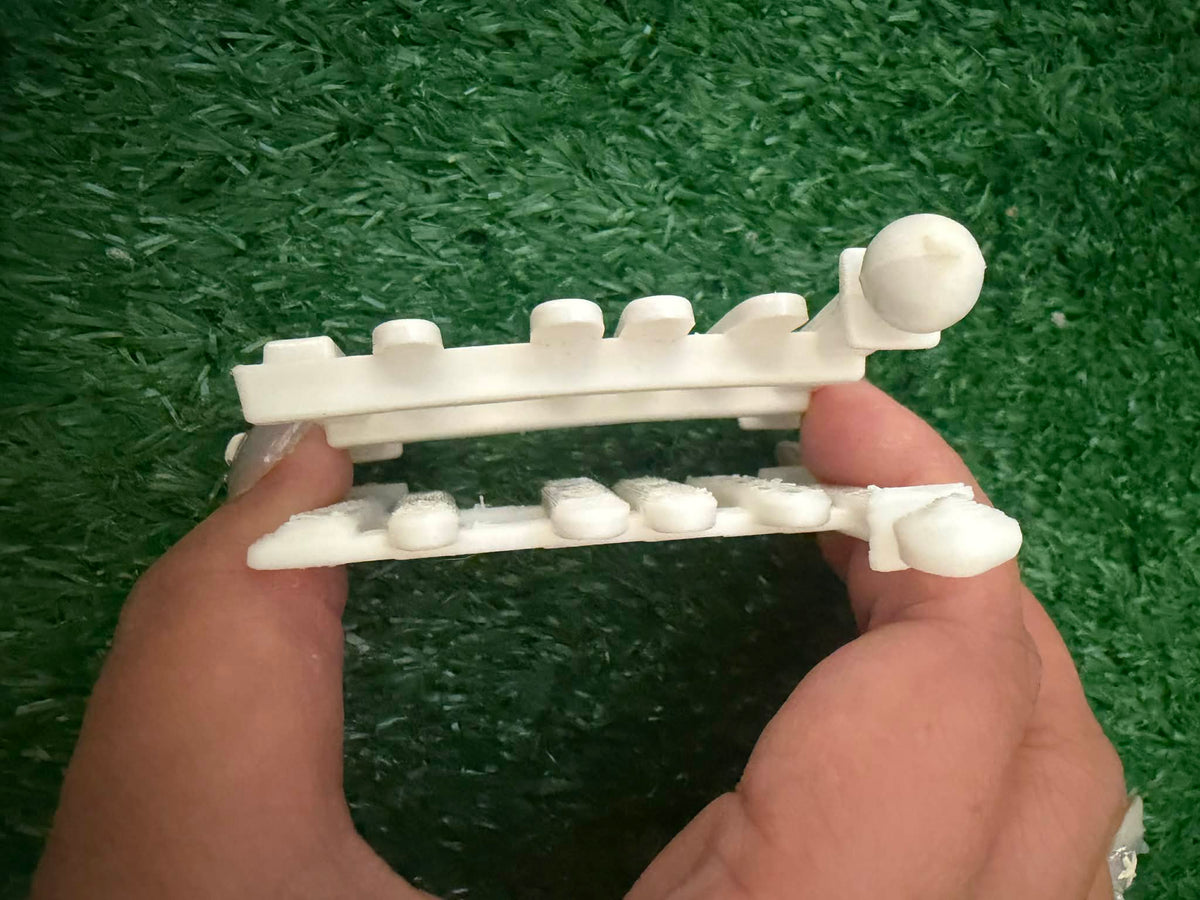 White fence accessory close-up with horizontal rail and short picket posts