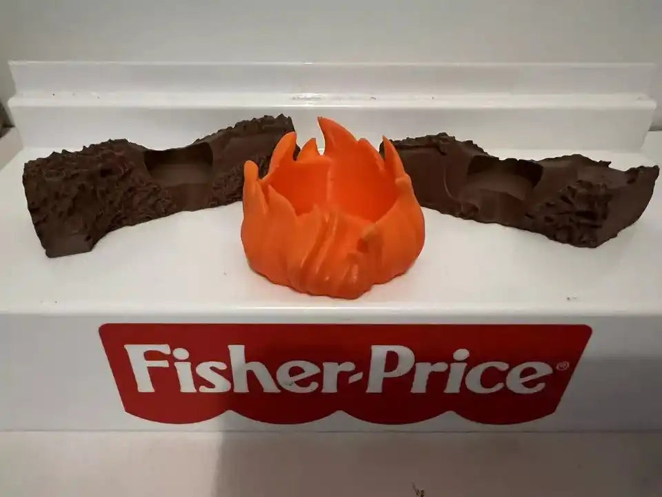 Orange campfire flame on brown logs in Fisher-Price tray