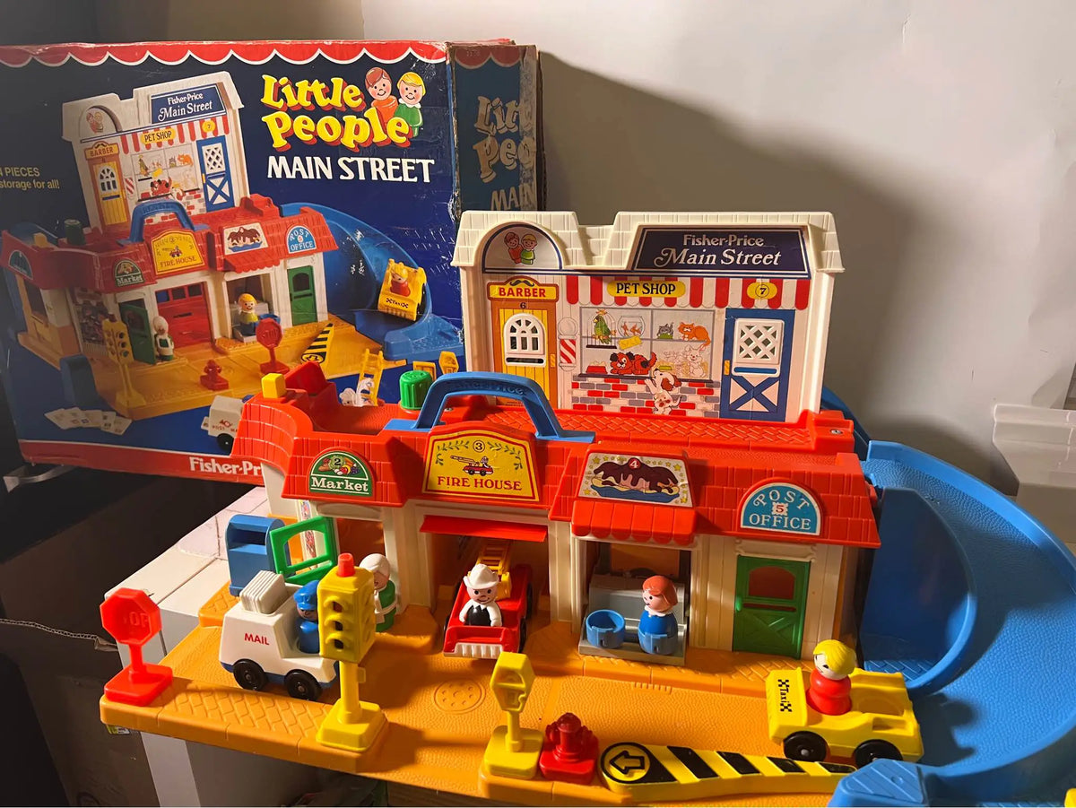 Main Street toy playset with fire station, office building, mail letters, cars and ramps